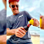 Fisher using the Original IkiPik fish spike bottle opener to open a beer after  dispatching a freshly caught fish